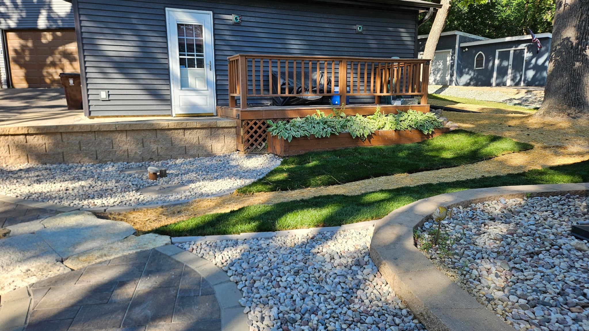 Fresh sod lawn installation with paver walkway and landscape design in Central Wisconsin