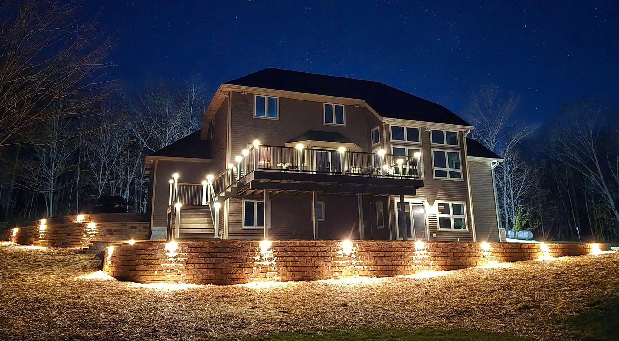 Segmental block retaining wall with integrated LED landscape lighting in Central Wisconsin