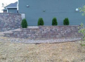 retaining wall, fire pit, walkway with crushed stone