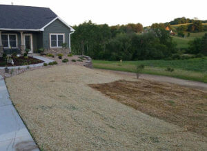 Retaining walls, erosion matting, erosion control, plantings, stone