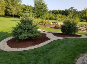 retaining wall, fire pit, walkway with crushed stone