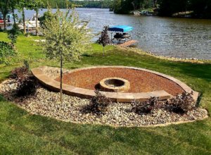 retaining wall, fire pit, walkway with crushed stone